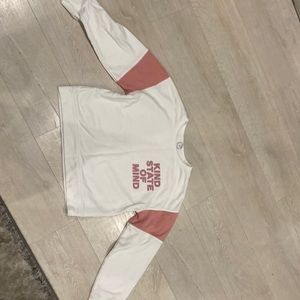 White and pink sweatshirt.